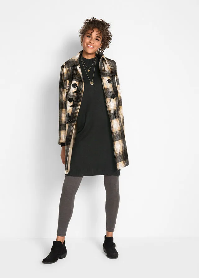 Black high-neck fine knit dress.