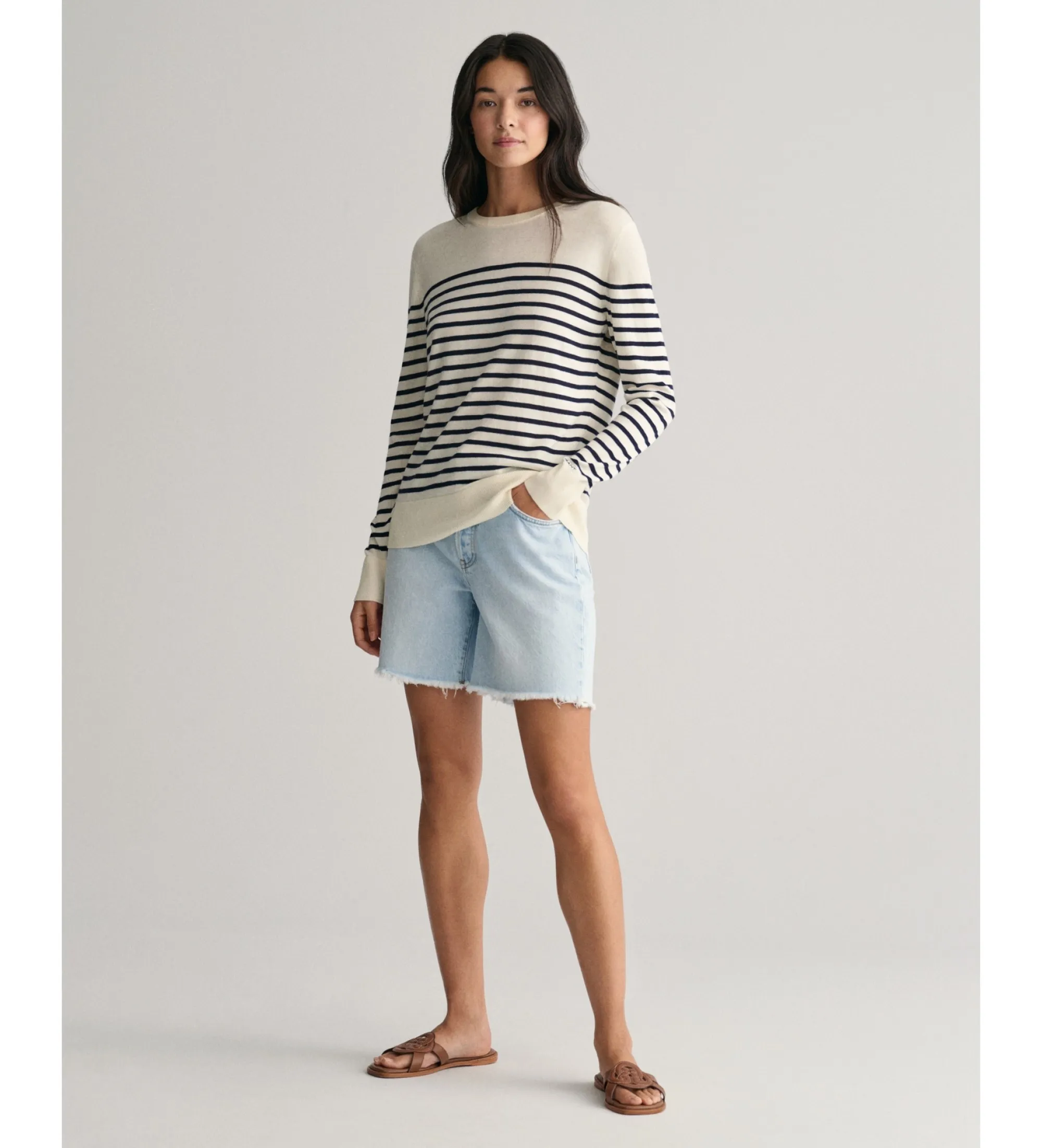 Round neck jersey with white fine knit stripes.
